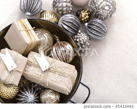 Arrangement of shiny baubles with xmas presents. Arrangement of shiny baubles with xmas presents. 45413042