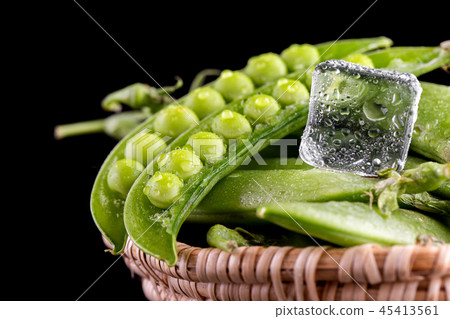 Sugar snap peas with mint on a rustic wood Sugar snap peas with mint on a rustic wood 45413561