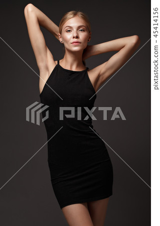 fashion model with long hair, perfect skin is posing in studio for glamour test photo shoot showing fashion model with long hair, perfect skin is posing in studio for glamour test photo shoot showing 45414156
