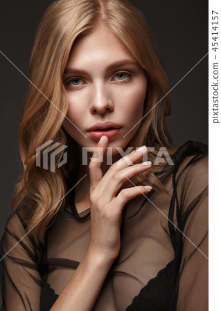 fashion model with long hair, perfect skin is posing in studio for glamour test photo shoot showing fashion model with long hair, perfect skin is posing in studio for glamour test photo shoot showing 45414157