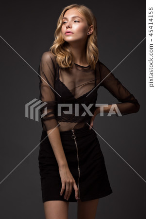 fashion model with long hair, perfect skin is posing in studio for glamour test photo shoot showing 45414158