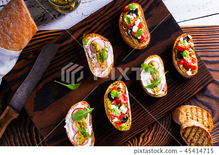 Fresh and crispy snack like bruschetta or crostini Fresh and crispy snack like bruschetta or crostini 45414715