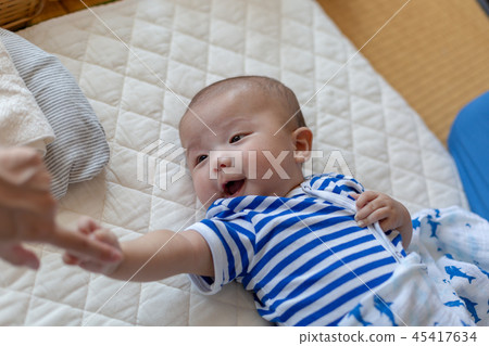 Smiling newborn baby Smiling newborn baby 45417634