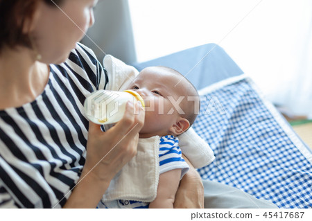 Smiling newborn baby and mother Smiling newborn baby and mother 45417687