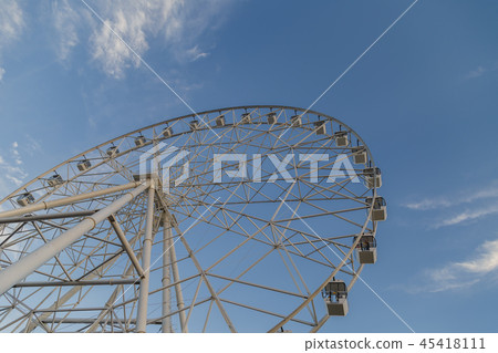 Very large Ferris wheel against the blue sky. Very large Ferris wheel against the blue sky. 45418111