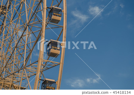 Very large Ferris wheel against the blue sky. 45418134