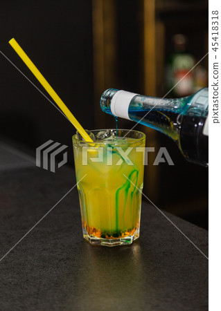 Colored cocktail on the bar in the nightclub 45418318