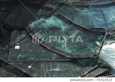 Crashed windscreens on a pile on a car service Crashed windscreens on a pile on a car service 45418523
