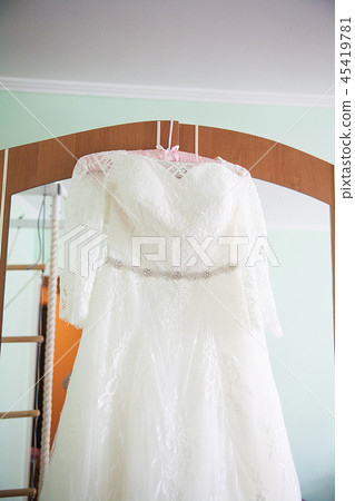 White Wedding dress on a shoulders, before ceremony 45419781