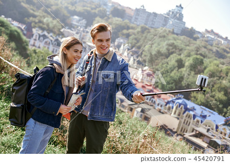 Happy young couple of tourists takes selfie portrait on european country Happy young couple of tourists takes selfie portrait on european country 45420791