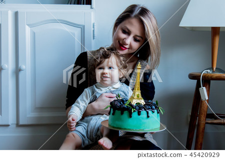 Mother and toddler boy with his first cake on Birthday 45420929