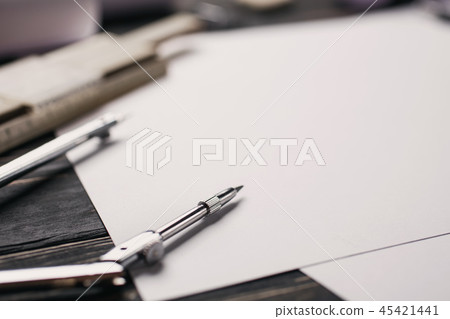 Work with the drawing. Office stationery on the table at the engineer 45421441