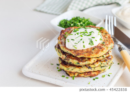 Vegetarian zucchini fritters or pancakes Vegetarian zucchini fritters or pancakes 45422838