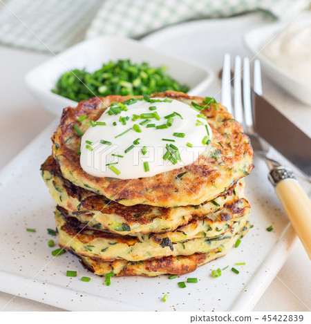 Vegetarian zucchini fritters or pancakes Vegetarian zucchini fritters or pancakes 45422839