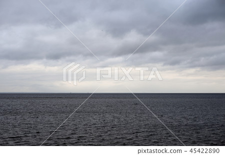 Dark cloud over sea. 45422890