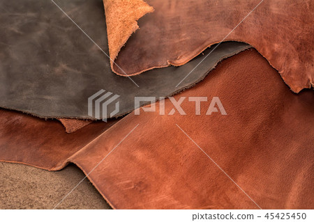 Texture of pieces brown leather. Natural material Texture of pieces brown leather. Natural material 45425450