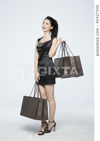 beautiful young woman shopping, sale concept photo. attractive young woman isolated. 174 beautiful young woman shopping, sale concept photo. attractive young woman isolated. 174 45427345