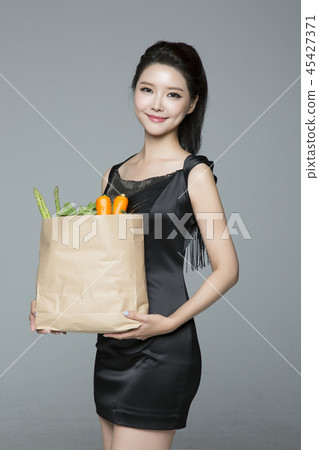 beautiful young woman shopping, sale concept photo. attractive young woman isolated. 183 45427371