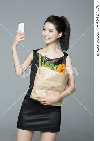 beautiful young woman shopping, sale concept photo. attractive young woman isolated. 182 45427376