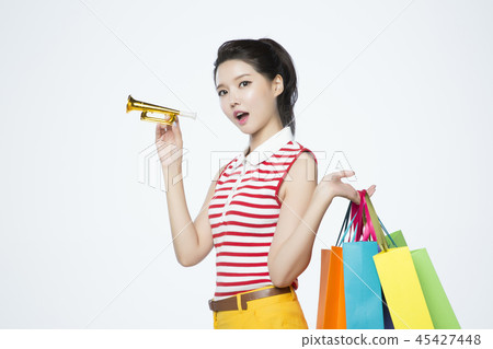 beautiful young woman shopping, sale concept photo. attractive young woman isolated. 132 45427448