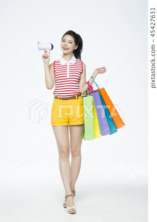 beautiful young woman shopping, sale concept photo. attractive young woman isolated. 092 45427631