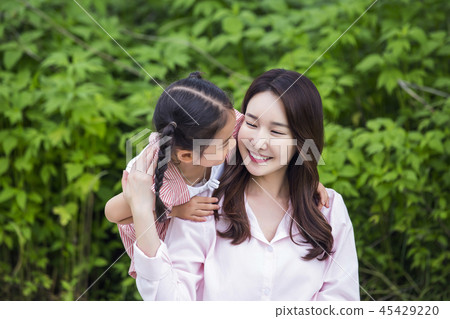 Family having picnic outdoors. Parents with two children relax in the park. Concept of happy family relations and carefree leisure time. 100 Family having picnic outdoors. Parents with two children relax in the park. Concept of happy family relations and carefree leisure time. 100 45429220