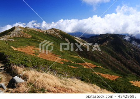 Landscape of the top of the Tohoku Iideho mountain Itoyo peak Honzan hut and Ichinouji mountain trail distant view Landscape of the top of the Tohoku Iideho mountain Itoyo peak Honzan hut and Ichinouji mountain trail distant view 45429683