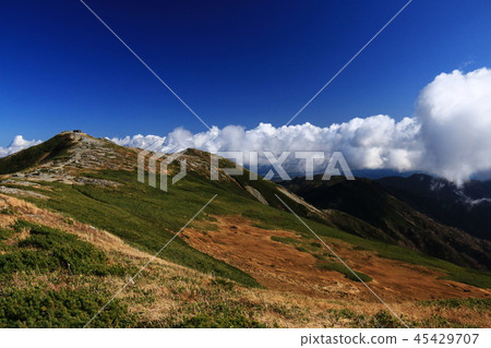 Landscape of the top of the Tohoku Iideho mountain Itoyo peak Honzan hut and Ichinouji mountain trail distant view Landscape of the top of the Tohoku Iideho mountain Itoyo peak Honzan hut and Ichinouji mountain trail distant view 45429707