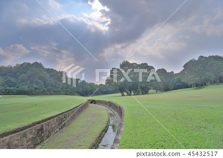 Green golf course cart path in cloudy Green golf course cart path in cloudy 45432517