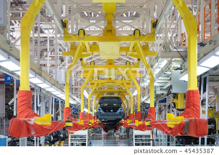 Transfer of car body. Robotic equipment makes Assembly of tcar. Modern car Assembly at factory Transfer of car body. Robotic equipment makes Assembly of tcar. Modern car Assembly at factory 45435387