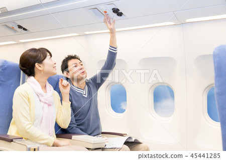 Airplane flight travel couple couple call button 45441285