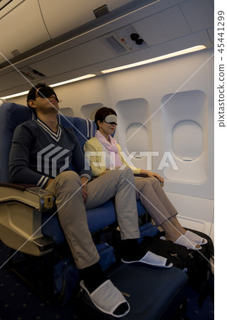 Airplane inflight travel couple sleeping eye mask Airplane inflight travel couple sleeping eye mask 45441299