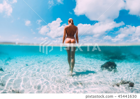 Beautiful naked woman in tropical ocean 45441630