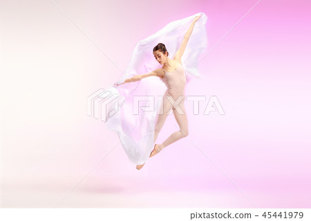 Ballerina. Young graceful female ballet dancer dancing over pink studio. Beauty of classic ballet. Ballerina. Young graceful female ballet dancer dancing over pink studio. Beauty of classic ballet. 45441979