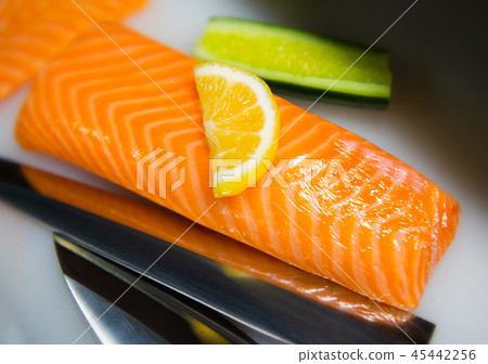Salmon cutting preparing for cooking. 45442256