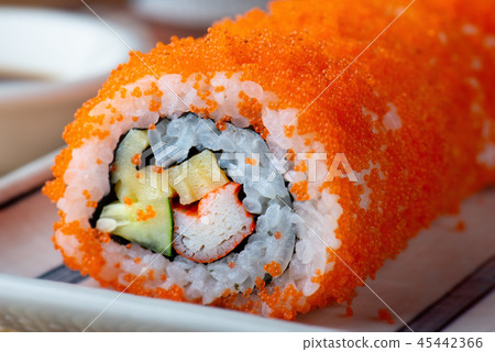 California Sushi roll cutting. California Sushi roll cutting. 45442366