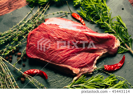 raw beef meat with spices on slate stone kitchen raw beef meat with spices on slate stone kitchen 45443114
