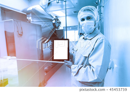 medical worker is showing the empty tablet, blured background medical worker is showing the empty tablet, blured background 45453739