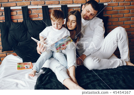 Family sitting in a bed 45454167