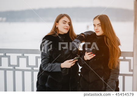 Girls in a winter park 45454579