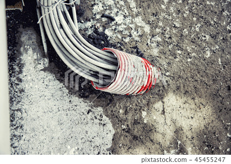 a large set of wires out of the hole in the pipe a large set of wires out of the hole in the pipe 45455247