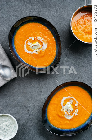 Top view of pumpkin soup in two plates plate and pot Top view of pumpkin soup in two plates plate and pot 45455873