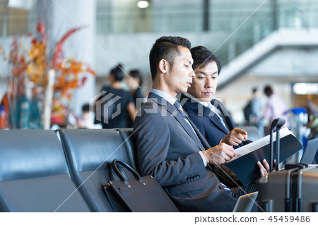 Businessman talking at the airport international airport work Businessman talking at the airport international airport work 45459486
