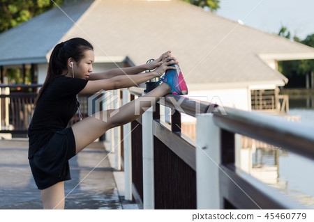 Women are stretching their muscles to prepare for the running in 45460779