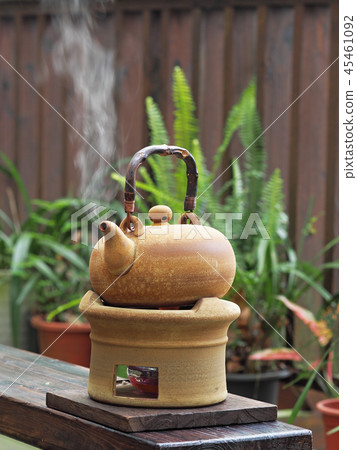 Old kettle put on a fireplace 45461092