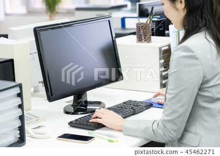 A woman heading to a computer 45462271