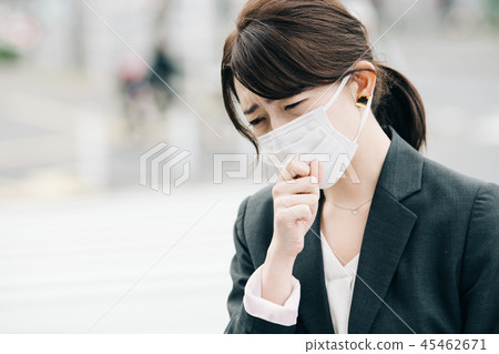 A Japanese woman in a suit wearing a masked business woman town A Japanese woman in a suit wearing a masked business woman town 45462671