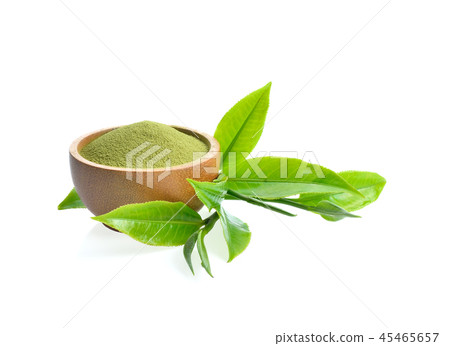 green tea leaves and powder on white background 45465657