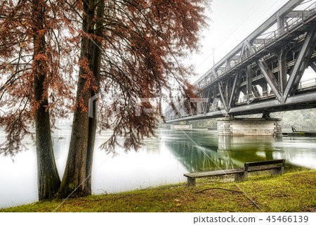 iron bridge on Ticino river in flood iron bridge on Ticino river in flood 45466139
