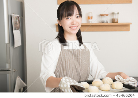 Young housewife with a baking board 45466204